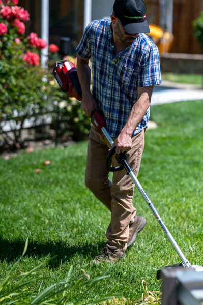 Man using weed eater